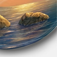 Designart 'Világítótorony egy sziklás part menti sziklán az Evening Light' tengeri és parti körfém fali művészet -